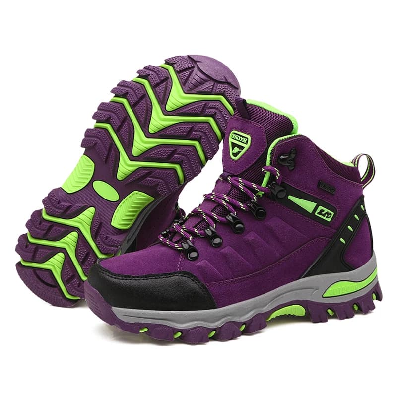 Bota de trekking feminina roxa com detalhes verdes, sola de borracha antiderrapante e cadarço ajustável