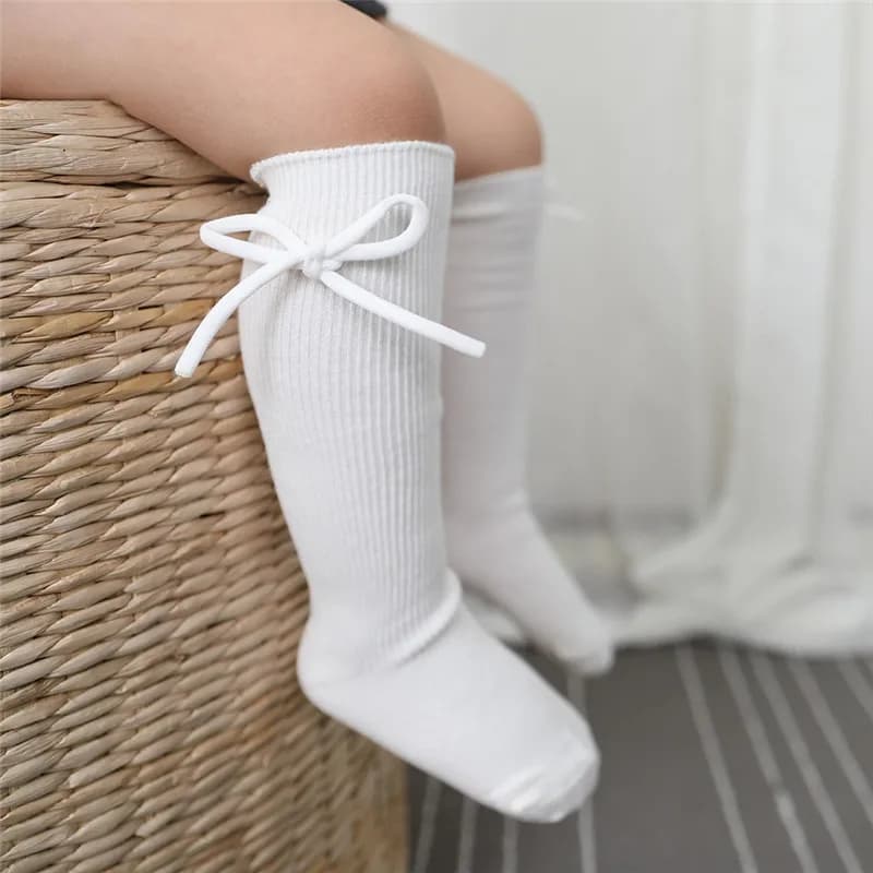 Outono crianças joelho meias altas do bebê meninas meninos bowknot plana longa meia de algodão macio sólido crianças princesa socken para 0-7 anos