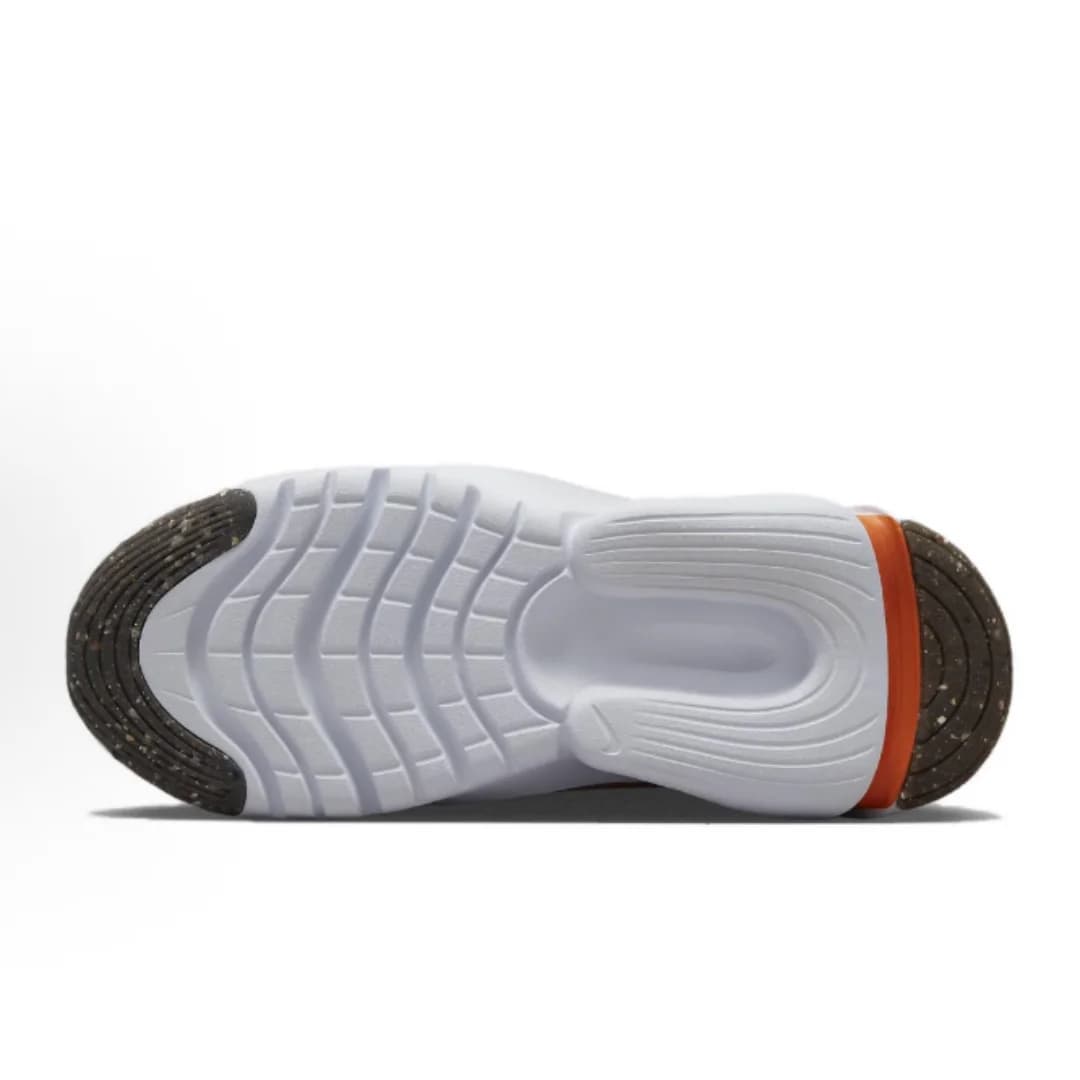 Sola antiderrapante branca do tênis Nike Flex Plus 2 feminino com detalhes em preto e laranja