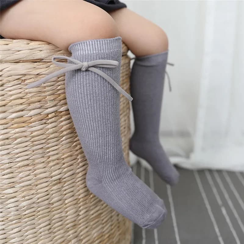 Outono crianças joelho meias altas do bebê meninas meninos bowknot plana longa meia de algodão macio sólido crianças princesa socken para 0-7 anos