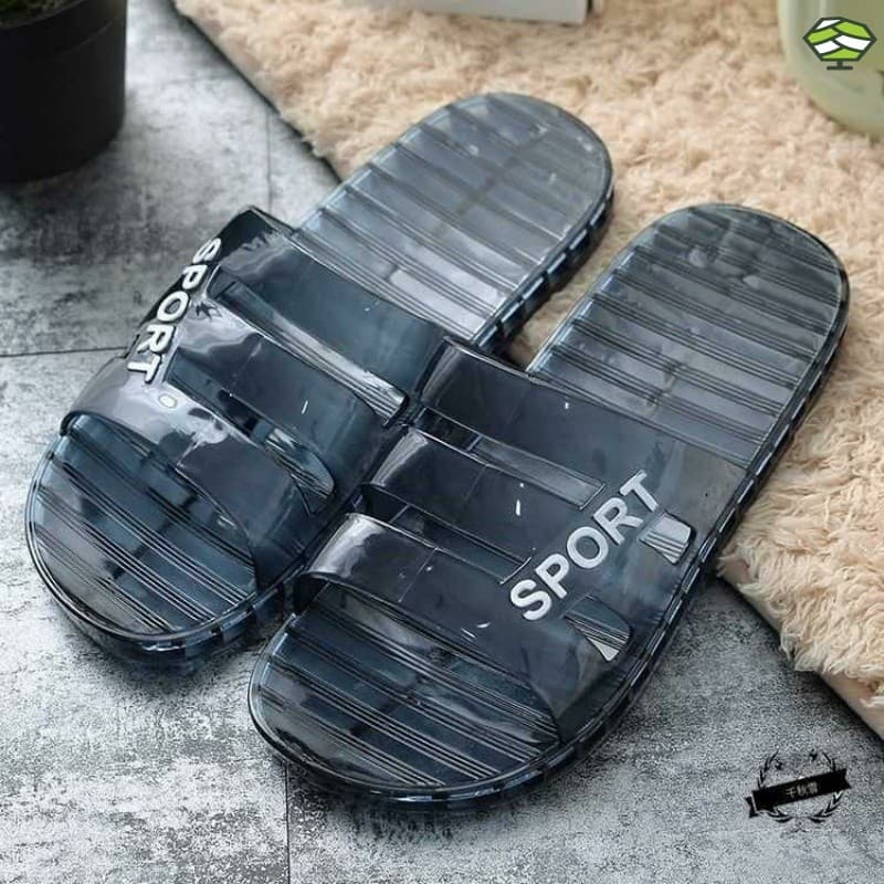 Chinelos transparentes pretos com design esportivo e texto 'SPORT' em branco