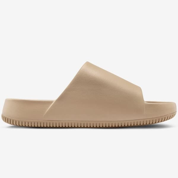 Sandália de slide Nike Calm Essential com sola texturizada, vista lateral em bege.