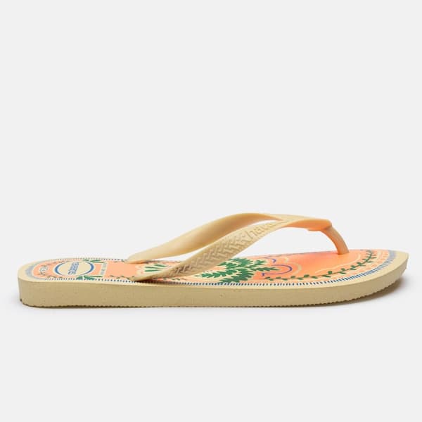 Chinelo Havaianas Top Summer Vibes Unissex com estampa de folhas verdes e azul em fundo laranja