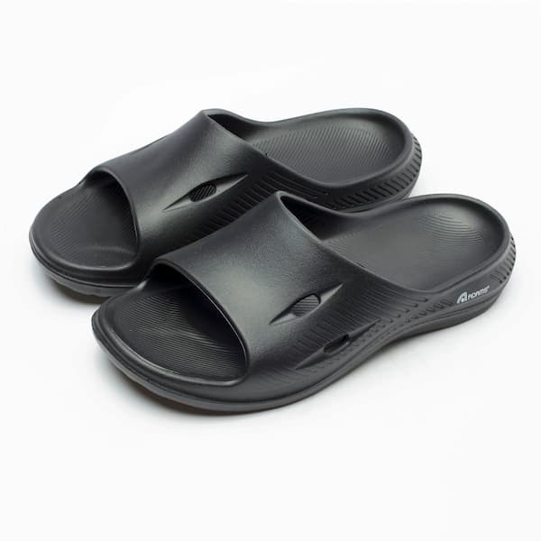 Chinelo slide Adams Space preto com textura perfurada, design ergonômico e logo Adams.