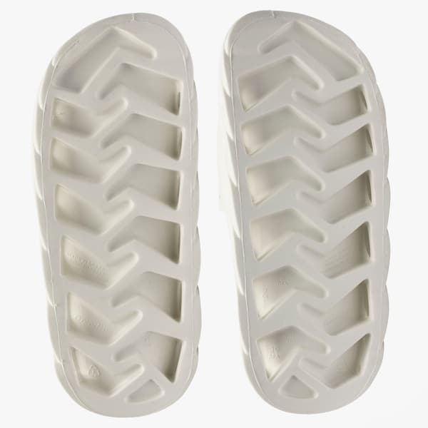 PUMA Rider Slide Synthetic, branco, com sola de padrão geométrico e respirabilidade.