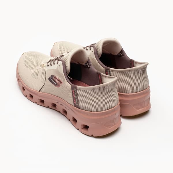 Tênis Skechers feminino branco e rosa respirável com sola rosa e design slip-ins.