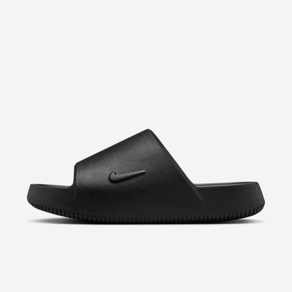 Vista lateral das sandálias Nike Calm Slide 2.0 pretas, em borracha, para mulheres.