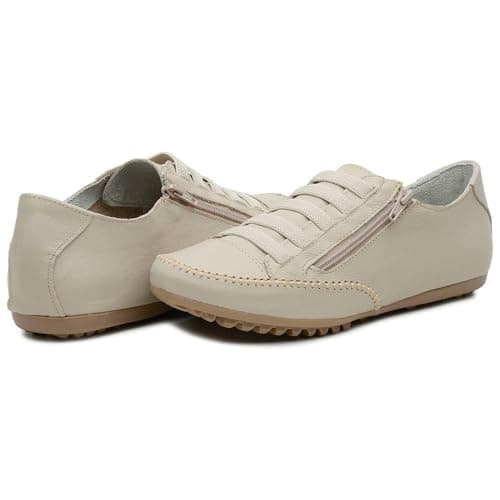 Tênis feminino casual bege com fechamento em zíper, sola baixa e design estrelado.