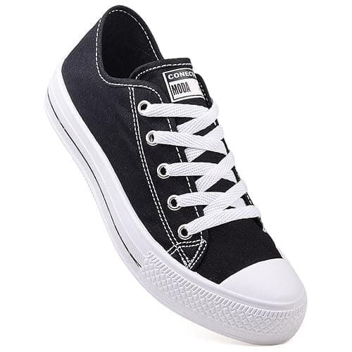 Ténis casual feminino cano baixo preto e branco com etiqueta Conecção Moda.