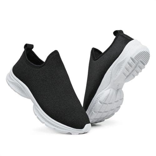 Par de tênis slip-on preto sem cadarço, com sola branca texturizada para melhor aderência.