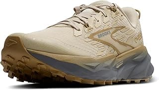 Tênis de corrida Brooks Cascadia 19 para mulher, cor bege com detalhes cinza e marrom, logo da marca visível.