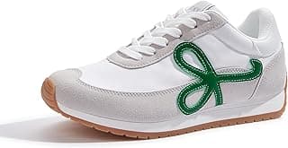 Tênis feminino branco com laço verde lateral, sola marrom, ideal para corrida e caminhada