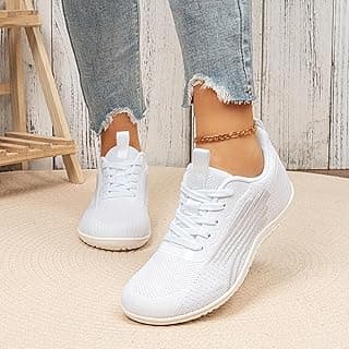 Tênis branco de corrida feminino com design de malha respirável