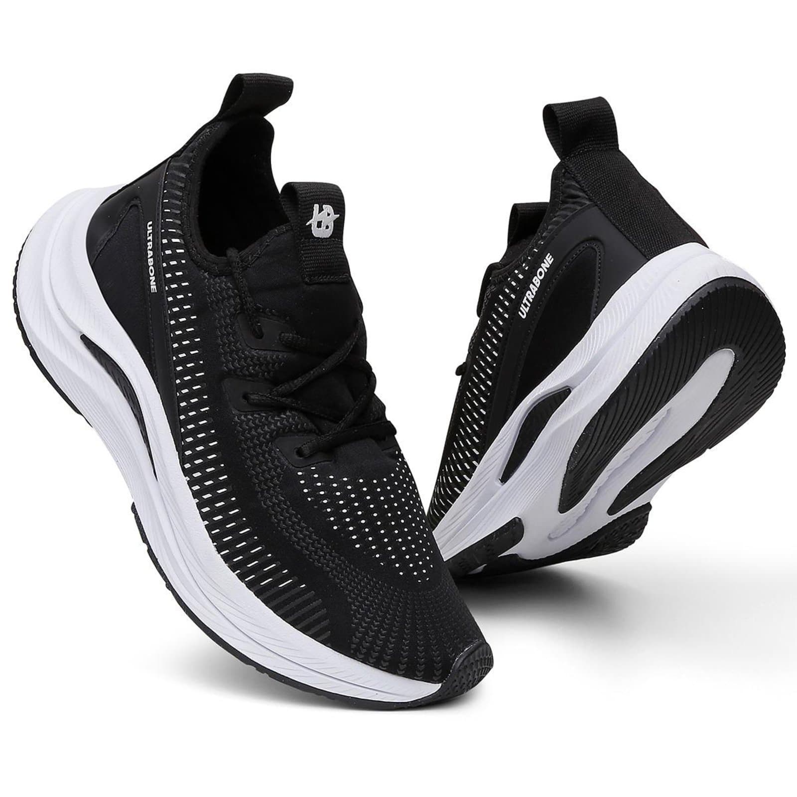 Par de tênis esportivo ortopédico antiderrapante feminino, preto e branco, vista frontal.